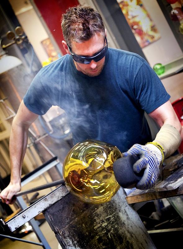 Brad in the hot bshop working on glass sculpture